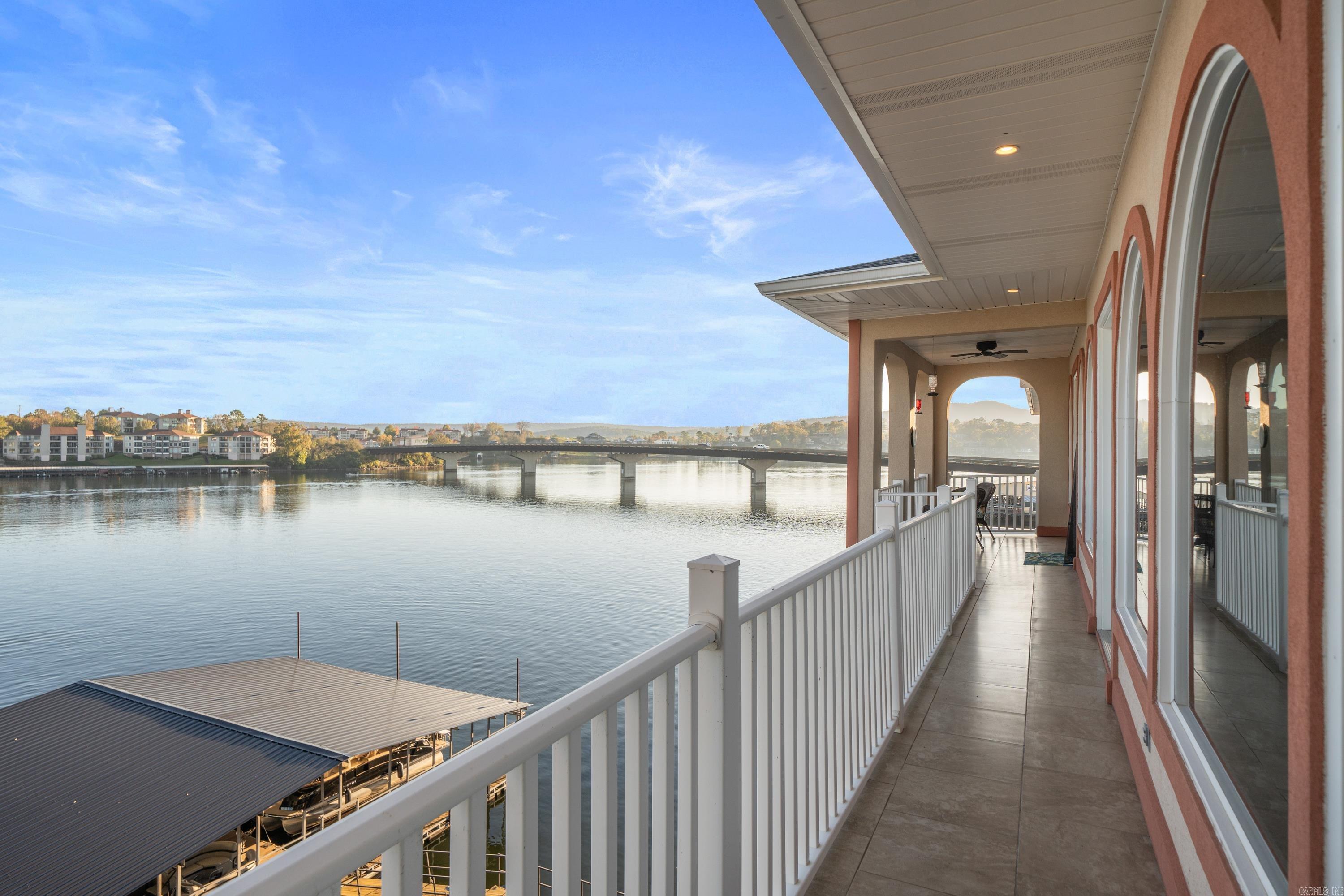 This Lakefront Penthouse condo has a view second to none on Lake Hamilton. No expense or details were spared. From the Gourmet Kitchen with Thermador Appliances to the open kitchen, dining, and living room floorplan. you will fall in love. Selling beautifully furnished. This prime Central Ave. location sets you right on the main channel and is close to all that Hot Springs has to offer. Highly sought Gated community with Covered parking at your private elevator.