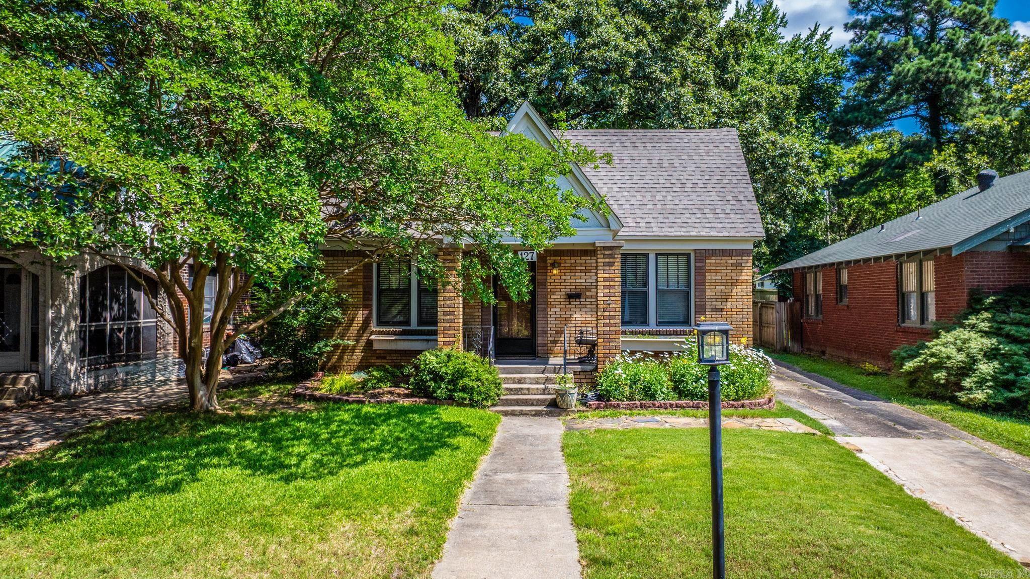 This charming 2 bed, 1.5 bath home is full of thoughtful updates and inviting spaces. Enjoy a beautifully shaded backyard from the comfort of the screened-in porch. Inside, the kitchen shines with quartz countertops, updated cabinetry, a gas cooktop, and under-counter oven. Both bathrooms feature new vanities. Major updates include a new HVAC (2024), roof (2021), and water heater (2020). Plus, a one-car detached garage offers added convenience.