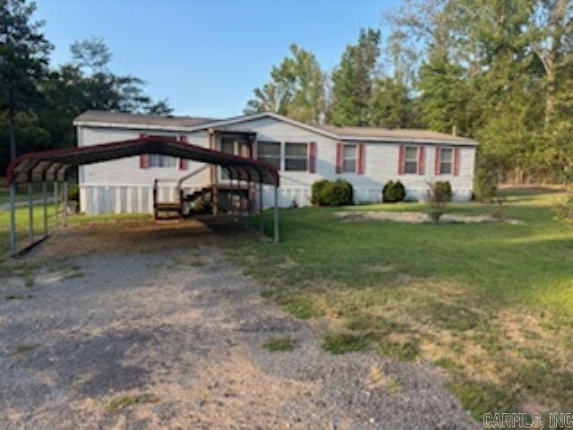 This 3 bedroom, 2 full bath home sits on 5 acres in a quiet neighborhood. The Property also includes an extra septic system, water and power hookups perfect for adding a guest house or future expansion, also has a storm shelter for peace of mind during severe weather. Enjoy country living with the convenience of modern utilities and room to grow. agents see remarks