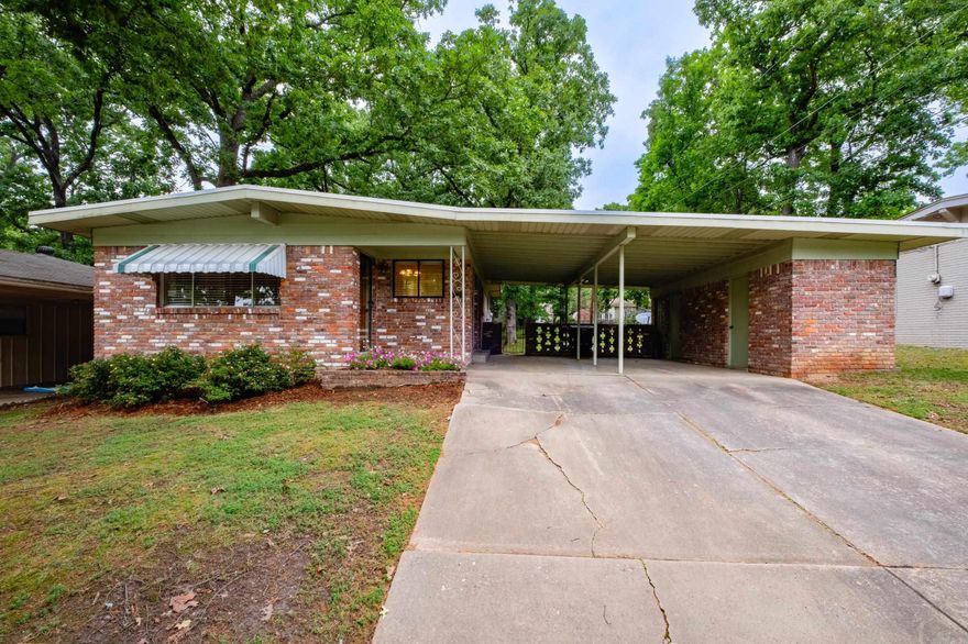 If you're looking for something centrally located with gorgeous hardwood floors and updated...this is it! Enjoy all the light throughout this mid-century modern, large back deck and fully fenced back yard, two car carport with tons of storage! Third bedroom was converted to a large bathroom and kitchen includes washer/dryer and fridge!