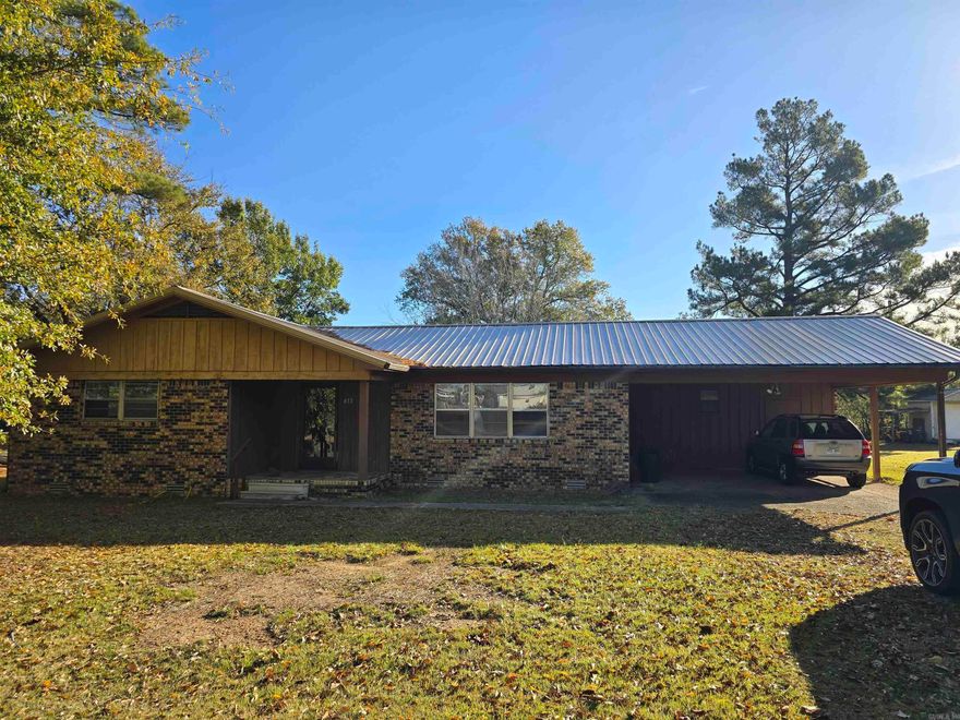 Discover this opportunity in Waldron, AR, with this spacious 3-bedroom, 2-full bathroom home. There is a Laundry Room and a 2 Car Carport. Situated on a generous 0.39-acre lot, this property offers the space and foundation you need to settle down or invest.  This home is ready for immediate occupancy. While it may not win any beauty contests (think practical, not pretty), it does offer you a turnkey functionality.