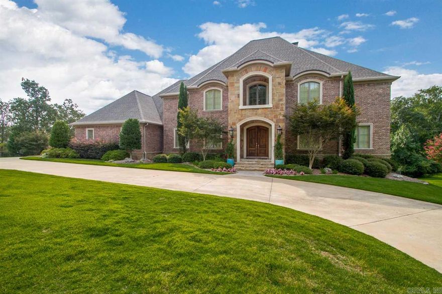 Rare find on over an acre+1/2 in a desirable, gated neighborhood. Convenient to shopping w/ easy access to interstate. 3 level, spacious home w/ designer finishes. Master+ guest suite on main level. Large eat in kitchen with wet bar and 2 breakfast bars. 20' ceilings in Foyer+ living rm. Downstairs has a BR suite, workout room, 1/2 bath and separate living space great for teens or in law quarters. Upstairs has 2 BR suites , theater rm. and a bonus rm. New pool liner, lighted sport court added in 2012