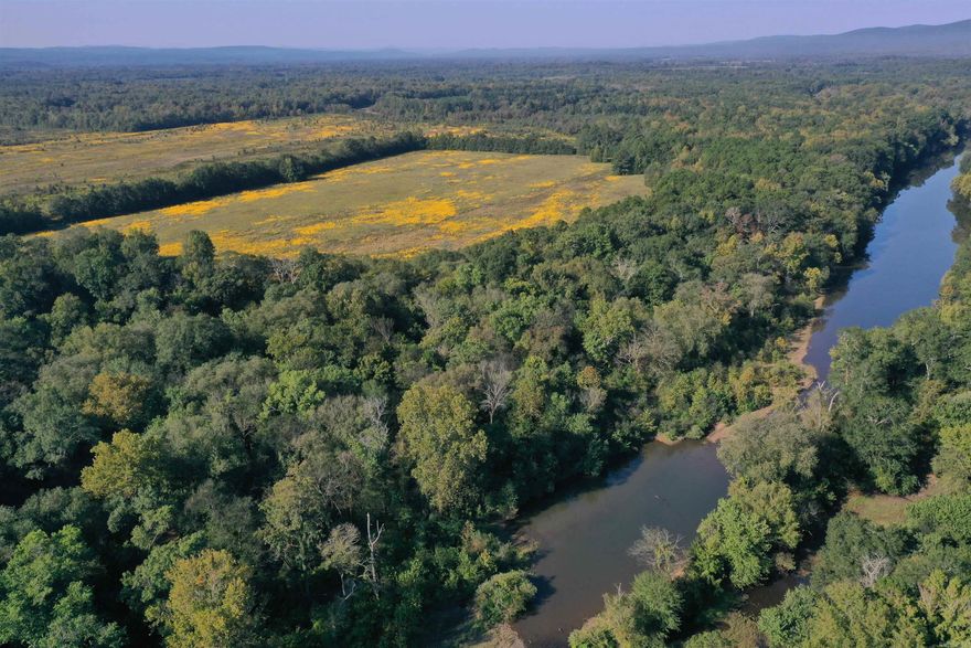 This Yell County 192 +/- Acre tract has the perfect blend of pasture and timber to make a top-notch hunting tract or homestead. The land is composed of mostly pasture, with areas of mature timber making perfect travel corridors, food plot areas, and stand locations. The property is accessed from Highway 28, making year-round access to the property’s hilltop build site a breeze. Power, city water, and fiberoptic internet are all available at the highway as well. A quarter mile of frontage on year-round Gafford Creek nicely compliments the Fourche La Fave River access along the back of the property. The Fourche River is known for its great bass fishing, and is home to bream, catfish, crappie, and other sport fish as well. Deer sign is abundance while touring the property, and with multiple stand locations, this tract would be great for an entire family. The farm is currently used for hay production and could make a phenomenal homestead/hunting combination property as well.