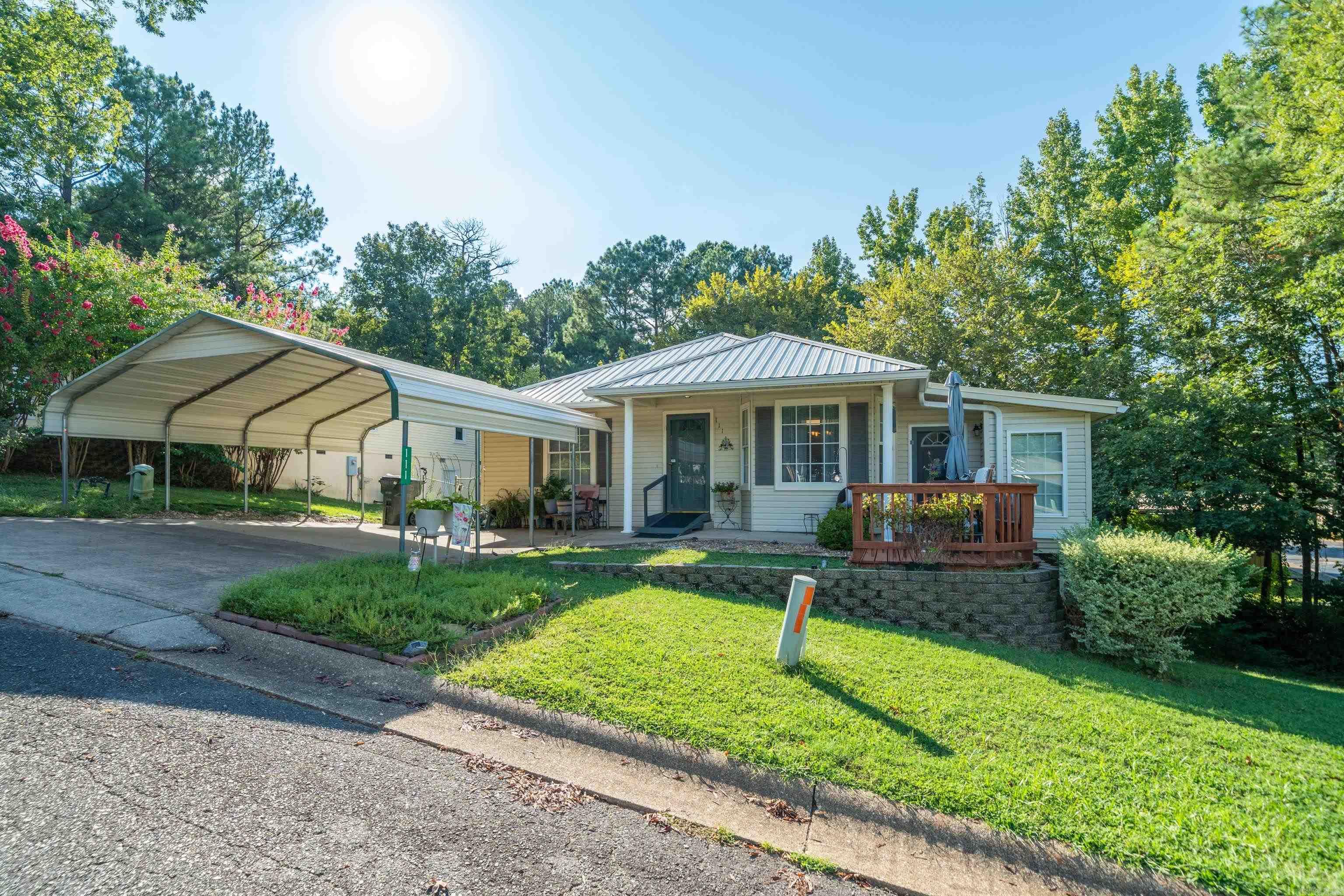 Welcome to this move in ready Cutie! A lovely home offering comfort, convenience, and plenty of charm. This property features a spacious layout with inviting living areas, a functional kitchen, and cozy bedrooms perfect for family or guests. A sunroom as extra bonus! Basement area has extra storage. New roof 2023. The home sits on a nice corner lot with room to enjoy the outdoors, whether youāre relaxing on the patio, gardening, or entertaining friends. Located in a quiet 55+ neighborhood, yet close to all that Hot Springs has to offerāshopping, dining, casino, and medical facilitiesāthis home is ideal for anyone looking for both privacy, convenience, and is a wonderful opportunity to own a piece of Hot Springs! Added bonus is a community pool and club house.