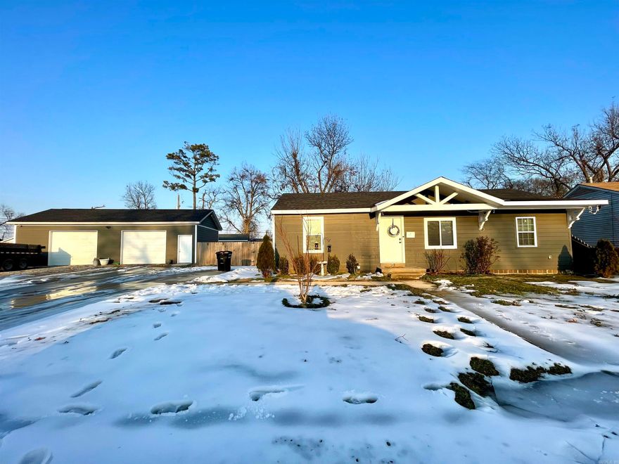 The large workshop will be your favorite thing about this home! This 3 bedroom, 1 bath home in Trumann, Arkansas has been completely updated 3 years ago, with big items taken care of such as roof, windows, HVAC, water heater, kitchen, bathroom, and more. There is no carpet, luxury vinyl plank flooring throughout, with ceramic tile in the bathroom. Out the back door there is a nice deck opening to the large, privacy fenced backyard. The hardie board siding is a beautiful color on the exterior and matches the workshop. The workshop is large with 1,200 sq ft, 100 amp electrical service, and a drain available for bathroom install. Call your favorite REALTOR® and schedule your private showing!