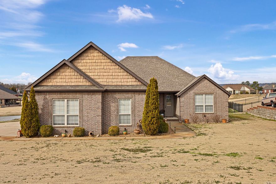 ELEGANT AND INVITING!!! Beautiful 4-bedroom, 2 bath home featuring a cozy fireplace and spacious 3 car garage. Enjoy stunning golf course-style landscaping and a large deck for entertaining or relaxing. The fenced backyard overlooks a peaceful pond, offering serene views you'll love coming home to.