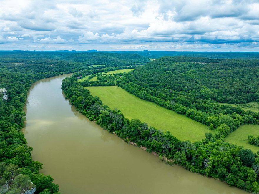 Breathtaking 600+/- acres overlooking the White River and the iconic bluffs of Calico Rock in the Ozarks! This rare gem offers stunning views, open hayfields, wooded hills for hunting, and a mix of cleared and timbered land perfect for farming, recreation, or building your dream home or cabin. Electricity is on-site in multiple locations, water is accessible, and there's even nearby railroad access. The property features a bird’s-eye view of the river valley—truly one of the most scenic locations in Arkansas. Whether you’re cutting hay, hunting, hiking, or just soaking in the views, this land has it all. A small barn has been converted into a hunting cabin, adding even more value. Drone footage available—come fly with us across this Ozark paradise! You have 3 phase electric and railroad.