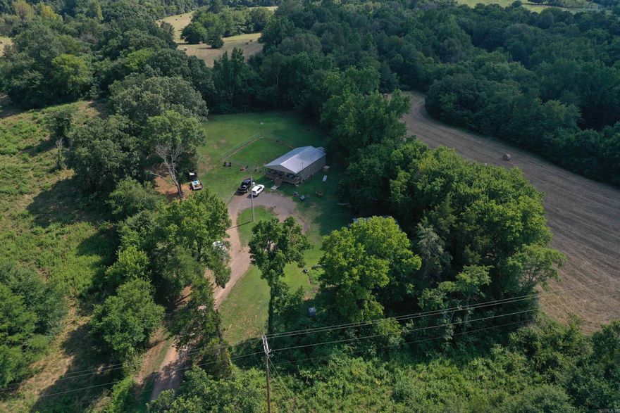 • 1120 +/- Sq. Ft. Home • 1 +/- Acres • Storage building • Covered Front Porch • Fenced Back Yard • Highway 80 Frontage • 2 bed 1 bath • Minutes from National Forest Access • Quiet and secluded setting • Mature Hardwoods • Fenced • Chicken Coop • Garden • City Water • Fiberoptic internet • Less than 10 Minutes from Danville
