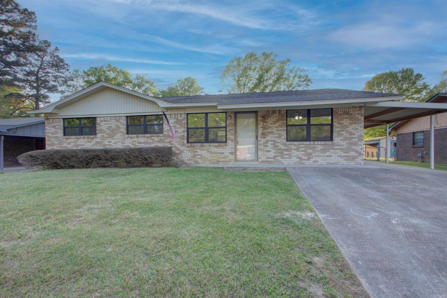Discover this beautifully maintained brick home in Texarkana, AR—the Smart Choice for discerning buyers seeking modern comfort and unbeatable tax advantages. Nestled in a prime location, the residence boasts a large covered patio that overlooks a spacious fenced backyard, creating the perfect setting for outdoor entertaining, family gatherings, or quiet relaxation. An attached carport adds convenient covered parking and extra storage. Inside, the expansive open-concept kitchen and dining room flow seamlessly together, offering an inviting hub for everyday living and special occasions. The home features three large bedrooms and two full bathrooms, including a private ensuite bath in the master suite for added luxury and privacy. This property has been thoughtfully updated in late 2025 and 2026 with premium upgrades throughout: a brand-new roof, new central heat and air system, new bathrooms, new kitchen cabinets with beautiful butcher block countertops, new appliances, a new tankless unlimited hot water heater, new luxury vinyl flooring, and new thermopane windows. These enhancements deliver energy efficiency, durability, and contemporary style from the moment you move in.