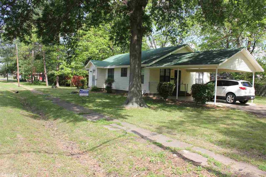Nice Home on a corner lot with carport and storage shed. It has two bedrooms and can be converted into 3 if needed. Hardwood flooring, separate laundry, siding for low maintenance, and all kitchen appliances included.