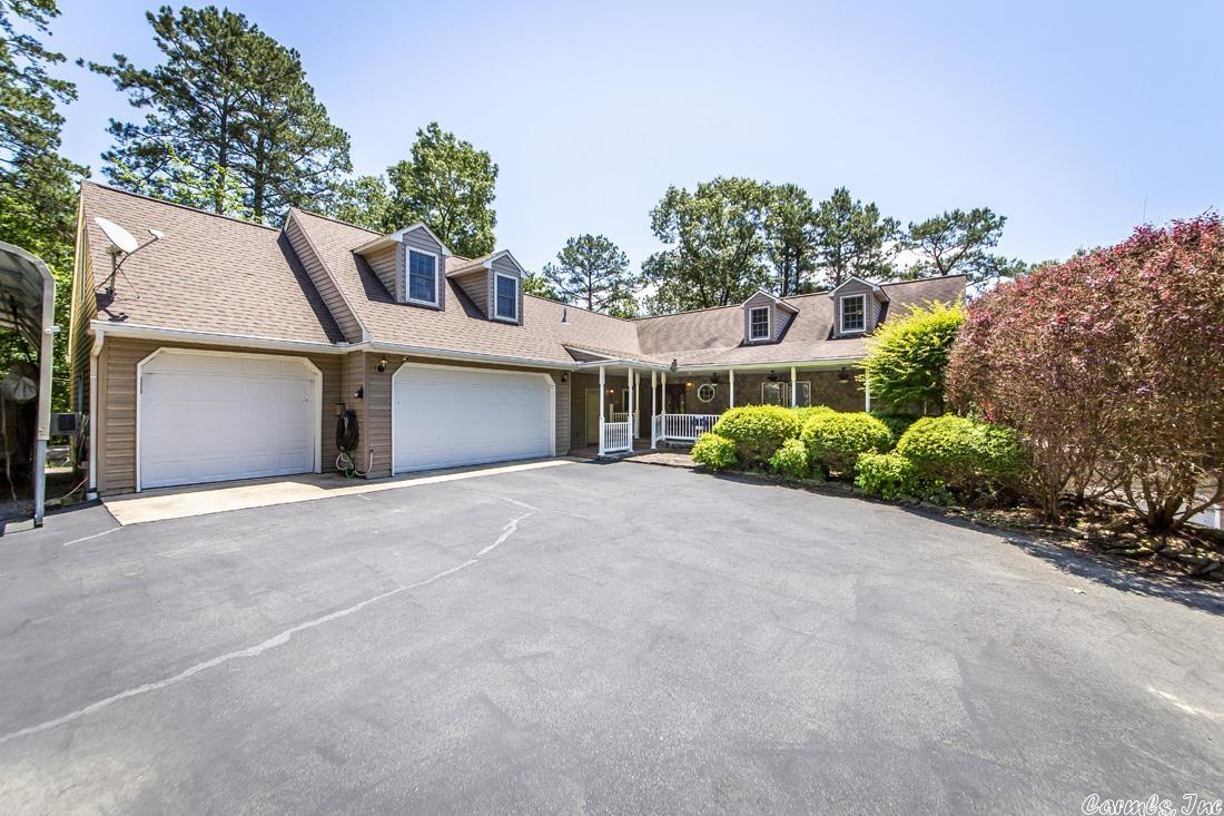Gated Lakefront Home w/4+ acres BOAT SLIP w/lift in dock behind your home.400' lakefront. Guest Quarters w/full kitchen could be rental income & Lower level make this home perfect for large families & entertaining guests.Could be great vacation rental. Anderson windows. Den off of master could be extra bedroom, storm shelter w/safe, whole house generator, 3 car garage w/man cave, 9' ceilings, zoned heating & air systems dual fuel, 2 upstairs office or hobby rooms, RV carport, exercise room See agent remarks