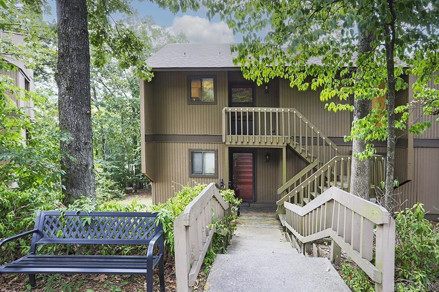 Pretty, upper level corner condo in a wonderful location! Updated with fresh paint, light hardwood floors and neutral finishes throughout. Wood burning fireplace. Pretty back deck overlooking the woods. Forest Park school district, close to Heights, Hillcrest, hospitals and more. Move-in ready!