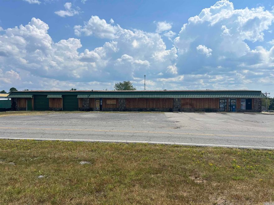 Attention Investors, Corporations, Entrepreneurs!!! Commercial Building and Land suitable for several potential income producing opportunities! This space is ready for someone with a great vision. This space is big enough to be another restaurant, convenience store, or indoor climate controlled store units. This building used to host a convenience store, liquor store, & offered units to lease as retail spaces. The inground fuel tanks, pumps, & canopy (which was replaced in 2020) are still there to bring a convenience store back to life in an area w/limited competition & at a high traffic 4-way stop intersection of Hwy 330 & Beaver Road. The tanks are ACT 100 tanks w/ 2 having an 8,000 gallon capacity & 3rd is 6,000 gallons. The suppresser system remains from when the store served food. Building comes with a 30 ft x 8 ft walk in cooler with 11 glass doors. The building has around 4,200 Sq feet of heated & cooled space w/(3) 5-ton commercial HVAC units installed in 2022, plus an additional 1,760 sq feet of warehouse space that was once a mechanic's shop. Best part is its only about 1 mile to Marina. People will definitely stop to fill their boats with cheaper fuel.Cameras do convey.