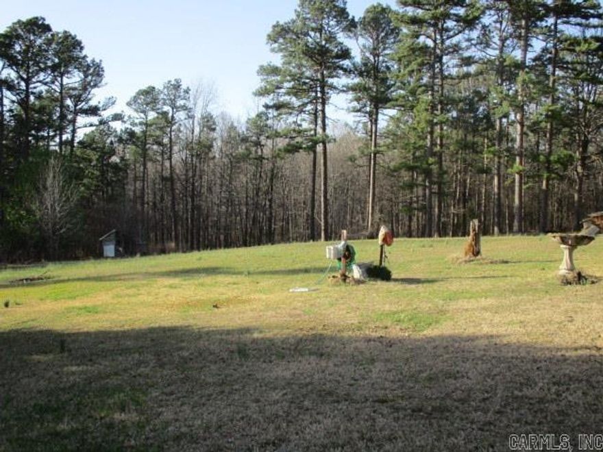 Beautiful land that affords great building area, large wooded area and most of all peace and quiet.  Mobile home is 2 BR, 2BA that is livable, but needs TLC. Must See!!