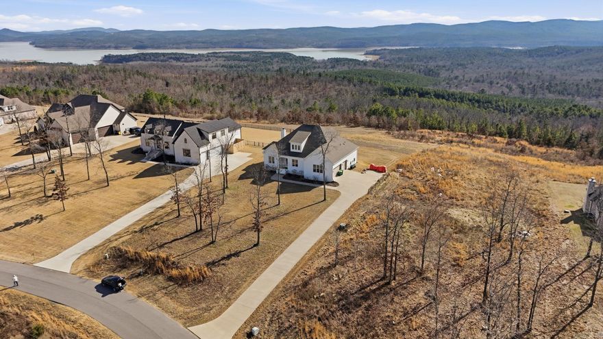 Open Concept floor plan with incredible views of Lake Maumelle, Pinnacle Mountain and the foothills of the Ouachita National Forest on 1.2 acre lot in gated subdivision. 4 bed 3 bath with room to add an ensuite bathroom and expand the upstairs significantly if desired. Ample storage space - custom finishes on the interior.