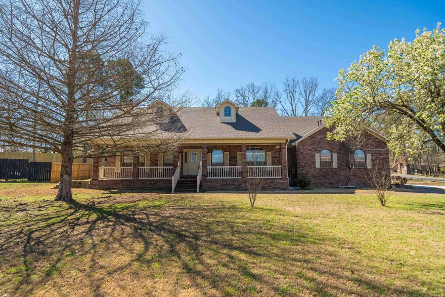 Charming house with character on a nice corner lot! Country atmosphere in upscale subdivision. Enjoy relaxing on your nice size front porch or covered back patio after a long day working in the city. Split floor plan, beautiful hardwood flooring, workable kitchen with granite counter tops, formal dining area, gas fireplace for those cold winter nights, large bedrooms with nice closets, lot of storage,  New roof 2024, Two car garage with new concrete drive, extra insulation and solar panels installed has cut utility cost in half, all municipal utilities, many updates and well maintained will make a great family home. Move in Ready! Brick and siding makes low maintenance exterior, Just minutes to shopping and restaurants. Lake Hamilton Schools!