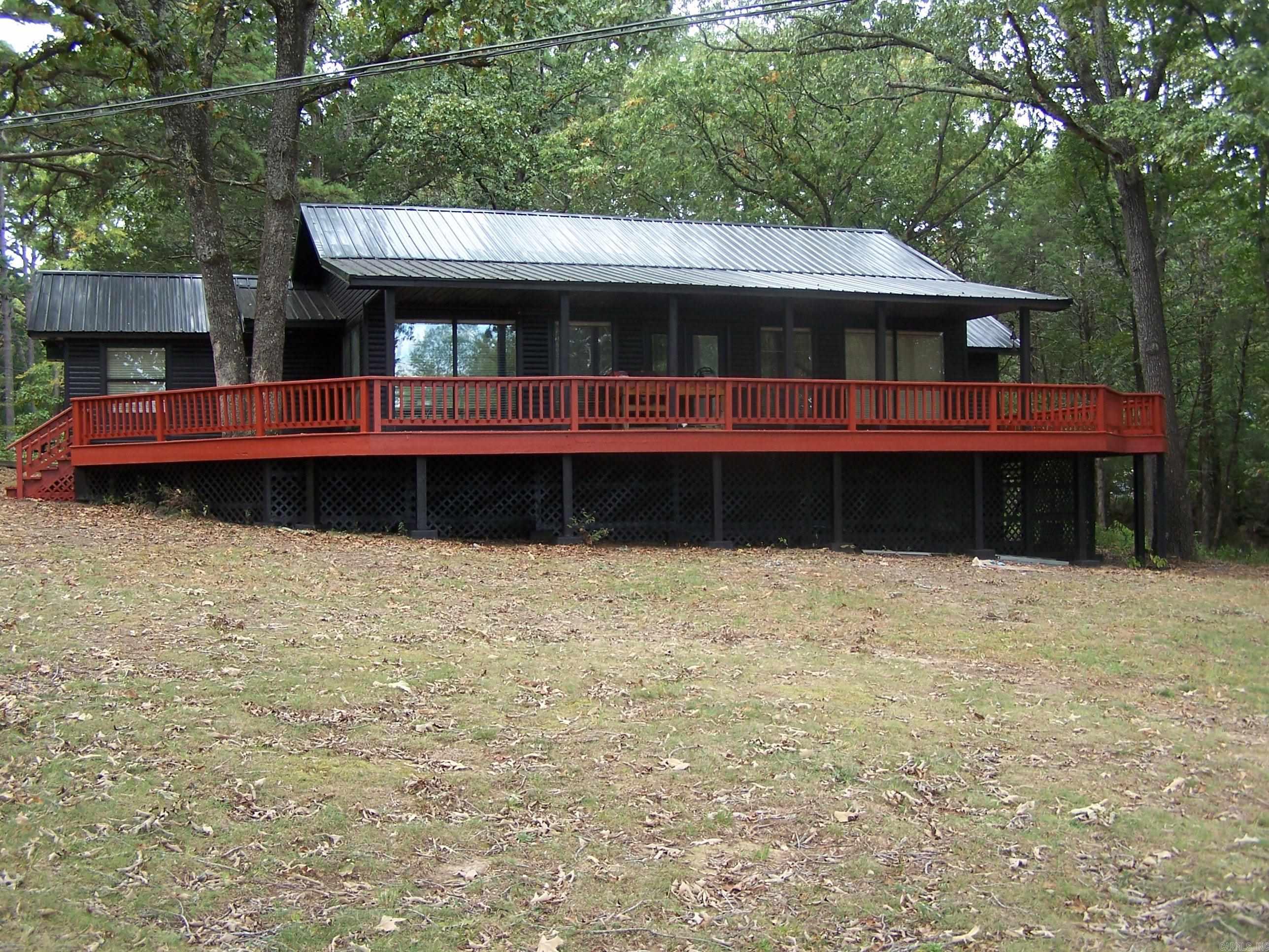 Unique opportunity-Three dwelling package...2 covered boat slips...waterfront 2.49 acres...no POA dues...very close to marina...view  of Sugerloaf mountain...first home is double wide mobile home all electric (1232 s.f. 3br 2bath 2004) second home is built around mobile home that has been renovated with new: metal roof, LVP flooring, kitchen and bath cabinets, hall bath shower, plumbing and paint, ...new exterior paint...deck refinished...all electric(1470 s.f. 3br 2 bath1997)...third home is built around vintage mobile home ...propane heat and range (851 s.f. 2br 1 bath 1960's)...some furniture included in all three (no nightly rentals)...plans for 3000 S. F. home included...agents must read confidential remarks...