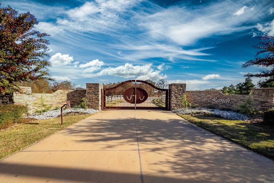 Beautifully distinct 10.3 acres on Palarm Creek within the Stone Hill Ranch gated community. The front 2.5 acres offers the perfect building site, which was resurveyed and lays above the 100yr flood plain. The lower back acreage offers 1600' secluded creek bank, a mature native pecan grove and rich pasture. The owners have a building site and custom house plans preapproved by the architectural committee available to the buyer. Septic plan and permit are approved. Water and Underground Electric from the road. Quick 10 minute access to I-40 then 5 min to I-430