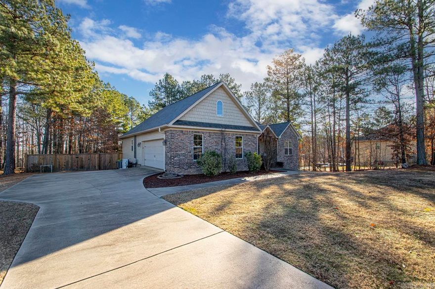 This craftsman style custom built Schrader home has been gently lived in and still has that new construction feel. This home offers tall ceilings, split floor plan, gas fireplace, hardwood floors, granite countertops, ss appliances, large site built shower, large safe room, large bonus room upstairs, covered deck, sits on a large wooded lot that is just over an acre. Schedule a showing today because this wont last long.