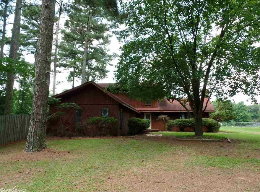 1.5 STORY FRAME CONTEMPORARY STYLE HOME SITUATED ON A LARGE LEVEL LOT LOCATED WITHIN THE CITY OF LEWISVILLE. HOME FEATURES: 3 BEDROOMS, 3 FULL BATHROOMS, CENTRAL COOL, CENTRAL HEAT, SPACIOUS LIVING ROOM WITH ROCK FIREPLACE, LARGE KITCHEN AND DINING AREA, ONE CAR CARPORT, WOOD FENCE AND DECK. PRIVATE UPPER LEVEL CONSIST OF BEDROOM SUITE WITH CUSTOM BATH. HUD CASE #031-363913, FHA FINANCING: IN (INSURED), PROPERTY IS SOLD IN AS-IS CONDITION, NO WARRANTIES, GUARANTEES OR REPRESENTATIONS ABOUT THE PROPERTY.