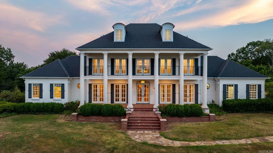 Stunning Hilltop Estate! Gorgeous architecture and exceptional floor plan built by noted builder Jack Hartsell. Unsurpassed views and privacy just minutes from 430. The ultimate Little Rock family retreat.  Beautiful entry with suspended staircase and 20-foot ceiling. Outstanding family room with soaring windows and handsome fireplace. Banquet dining room for spectacular entertaining. Fabulous breakfast area flows into custom gourmet kitchen with stunning cabinetry and with large butler's pantry. Elegant primary suite on the main level with luxurious spa inspired bath. Additional guest bedroom on the main level with large home office/library. Upstairs: Two additional spacious bedroom suites along with media/playroom. A beautiful setting and place to call home!  See agent remarks.