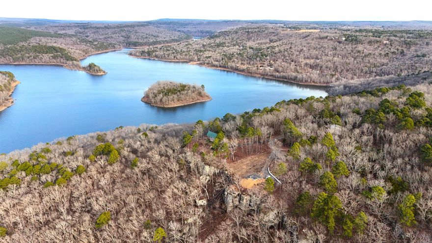 Ever dreamed of a cabin with a lake view? This beautiful 1 acre M/L lake view lot sets back at the end of a quiet little subdivision. With a 24x18 foundation ready for your tiny house or cabin. With the foundation, water well and perc test from 2023 this lot is ready to be YOUR HAPPY PLACE.