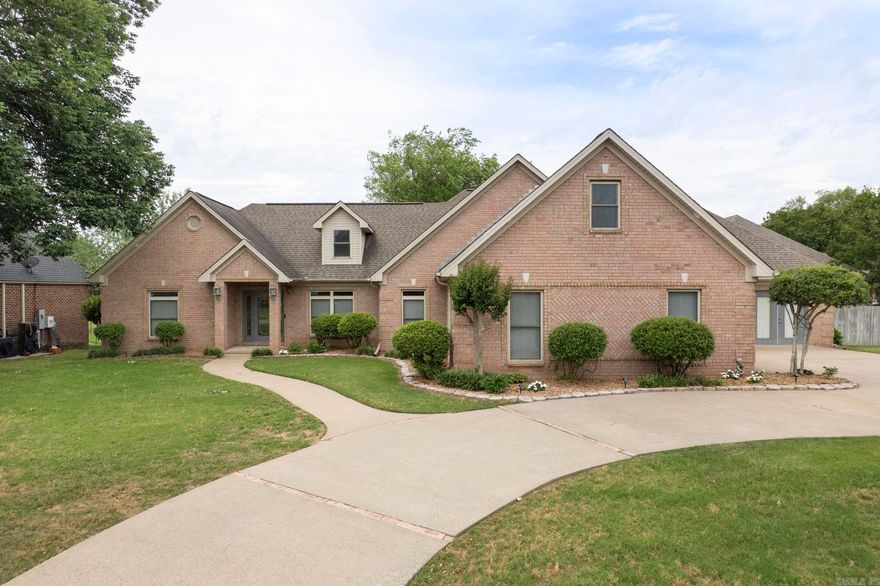 Nestled in the desirable Hurricane Lake Estates subdivision in Benton and located within the highly sought-after Bryant School District, this 3-bedroom, 2.5-bath home offers the perfect blend of comfort, functionality, and scenic lake living. The open floor plan creates an inviting atmosphere with a spacious living area featuring a cozy fireplace and seamless flow into the oversized kitchen—ideal for entertaining or everyday living. The half bath is a safe room. The primary suite offers a relaxing retreat with a private en-suite bath and walk-in closet, while the bonus room provides flexible space for a home office, playroom, or media room. Step outside to enjoy the covered patio overlooking Hurricane Lake, perfect for morning coffee or evening sunsets. The fenced backyard adds privacy and space for pets or outdoor gatherings and take advantage of your own place to dock a boat. Don’t miss this opportunity to enjoy lakefront living with convenient access to shopping, dining, and schools. Some photos have been virtually staged. Buyers to verify lot size using their own measurements.