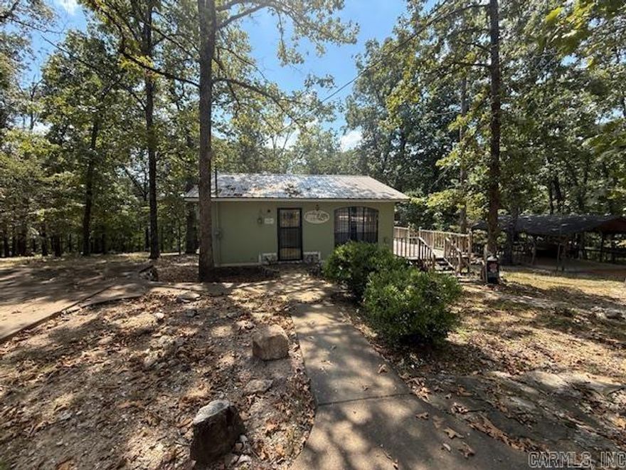 Looking for a cozy cabin in the woods with shop and pavilion? You have found your slice of paradise in this turn key ready 2 bedroom 2 bath cabin in Hardy, Arkansas. Approx 896 sf. of living space and covered deck on back to enjoy nature and your surroundings. All the comforts of home available here including two bathrooms and a fully equipped kitchen. 2 parcels include approx 8.80 acres of land. Originally built in 1994 and addition in 2023 updates/primary en-suite added with covered deck Call or text listing agent to show