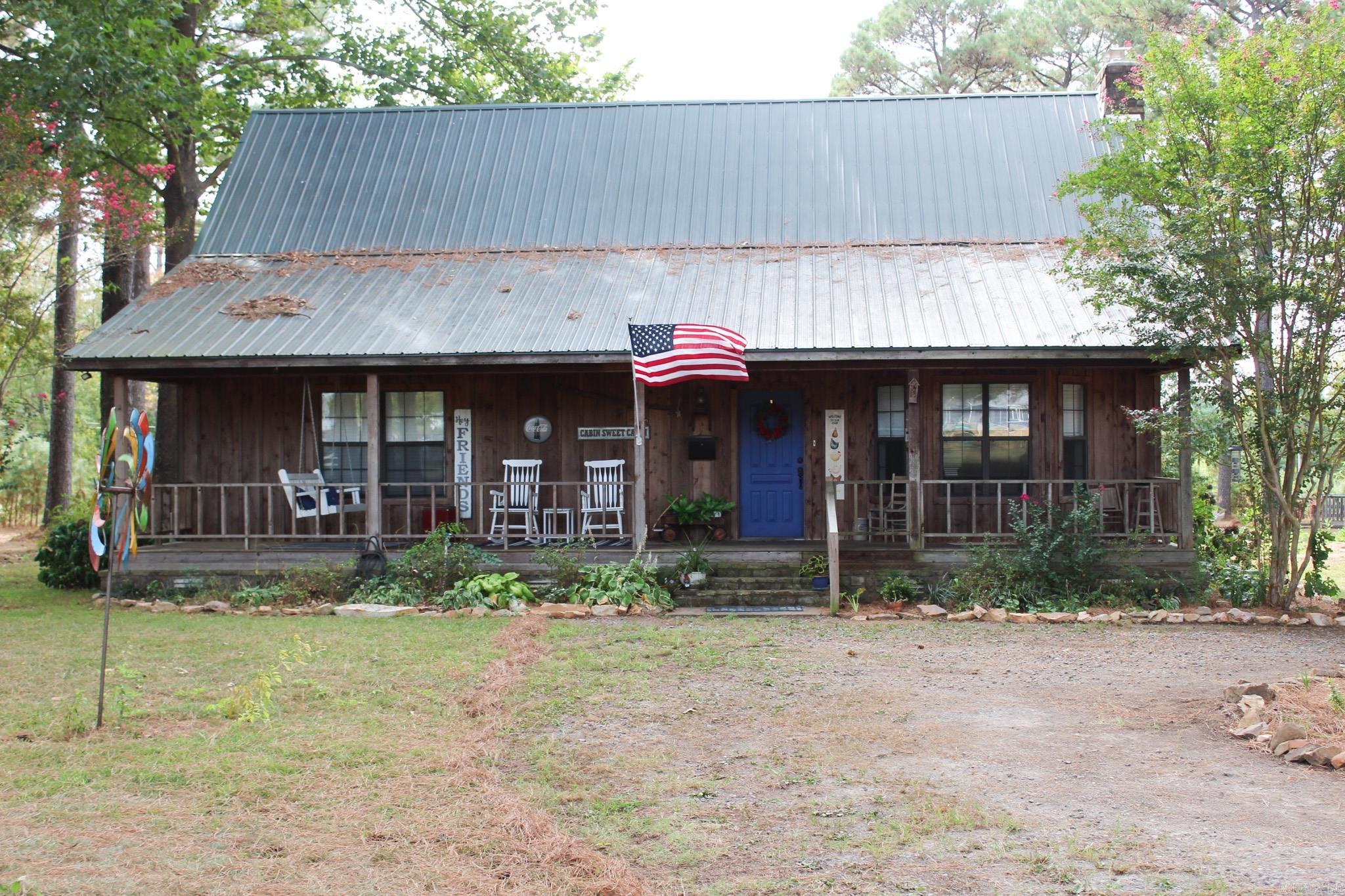 Are you dreaming of the perfect blend of rustic charm and modern convenience? Look no further! Nestled on a spacious plot, this delightful cabin offers the luxury of country living while ensuring easy access to all the amenities the city of Searcy has to offer. Despite its rustic exterior and traditional charm, the cabin has undergone several impressive updates to enhance comfort and efficiency. You'll find a 2-stage HVAC unit installed in 2025, along with new mini-split systems in the upstairs bedroom and bonus room. The plumbing has been updated with durable PEX to reduce the likelihood of leaks and ensure long-term reliability, and the kitchen features a new dishwasher, replaced in 2023, for added convenience. One of the cabin's standout features is its vaulted ceilings and large windows. The exterior of the cabin is just as impressive as its interior. You'll find a well-maintained deck equipped with gas access for your grill. Animal lovers and hobby farmers will appreciate the chicken house and rabbit hutches, while the expansive yard offers ample space for a hobby garden, presenting endless possibilities for those with a green thumb. AGENTS SEE REMARKS.