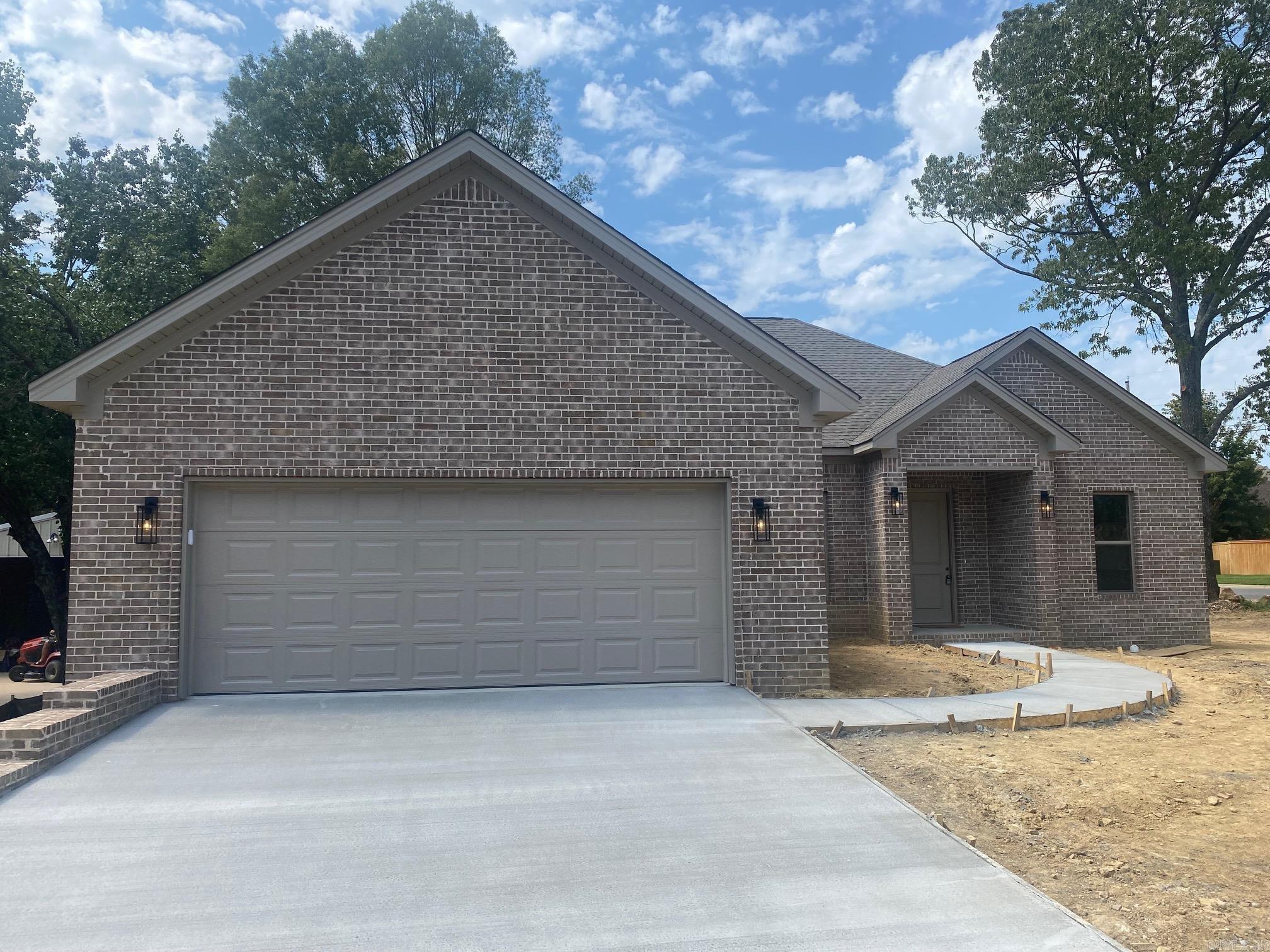Beautiful new construction in Sherwood featuring a 1,764 sq ft with 9' ceilings and luxury vinyl floors. This home features a spacious great room, dining area, eat-in kitchen with 10' ceilings, equipped with Whirlpool appliances, stainless steel dishwasher, microwave, and Delta fixtures. The master suite includes a 10' pan ceiling and boasts large his-and-her walk-in closets. The master bath features a separate shower and tub. Situated on a generous 0.28-acre corner lot with an oversized two-car garage and a storage room including a 50-gallon hot water tank. The attic includes a floored area for extra storage. Enjoy a covered back porch and peace of mind with a one-year builderās warranty.