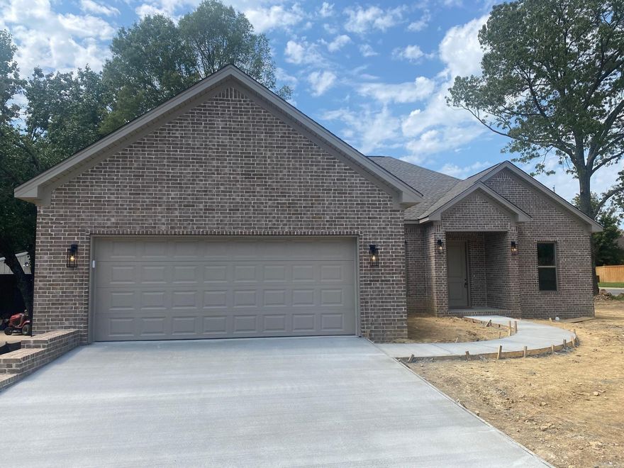 Beautiful new construction in Sherwood featuring a 1,764 sq ft with 9' ceilings and luxury vinyl floors. This home features a spacious great room, dining area, eat-in kitchen with 10' ceilings, equipped with Whirlpool appliances, stainless steel dishwasher, microwave, and Delta fixtures. The master suite includes a 10' pan ceiling and boasts large his-and-her walk-in closets. The master bath features a separate shower and tub.  Situated on a generous 0.28-acre corner lot with an oversized two-car garage and a storage room including a 50-gallon hot water tank. The attic includes a floored area for extra storage. Enjoy a covered back porch and peace of mind with a one-year builder’s warranty.