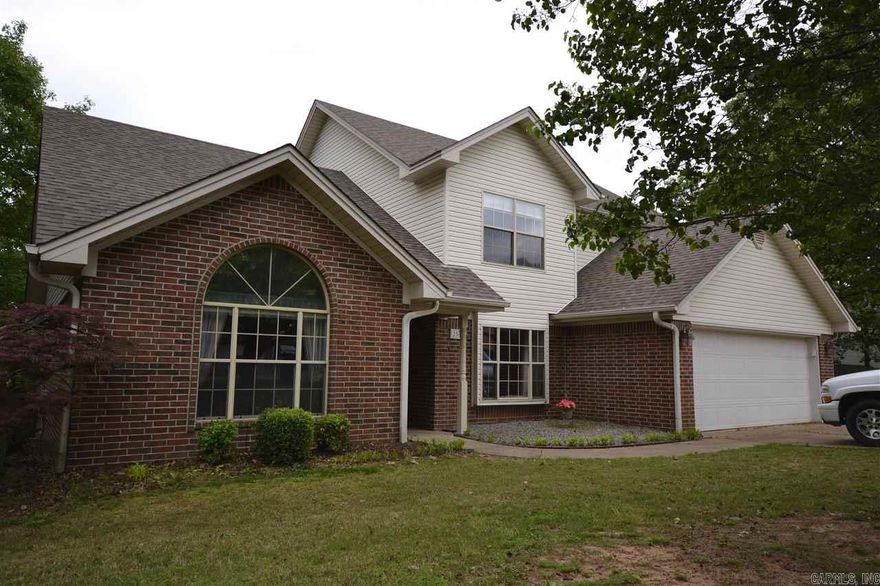 MOVE IN READY!!!!Space Galore in this Wonderful 5 bedroom/ 2.5 Bath Home!!! Beautiful Hardwood Laminates Throughout! Eat-in Kitchen w/ TONS of Cabinets & Bar, Separate Dining, Living Room w/Fireplace & Vaulted Ceiling! Master BR Main Level features His & Her Sinks, Jacuzzi Tub & Walk-n Shower! Guest Suite w/sitting area upstairs PLUS 3 Bedrooms & Bath! Large Tree-shaded Backyard w/HUGE 2-Tier Deck for Relaxing and Entertaining. 2-car Garage & Extra Parking for Boat or Camper. Move-in ready.