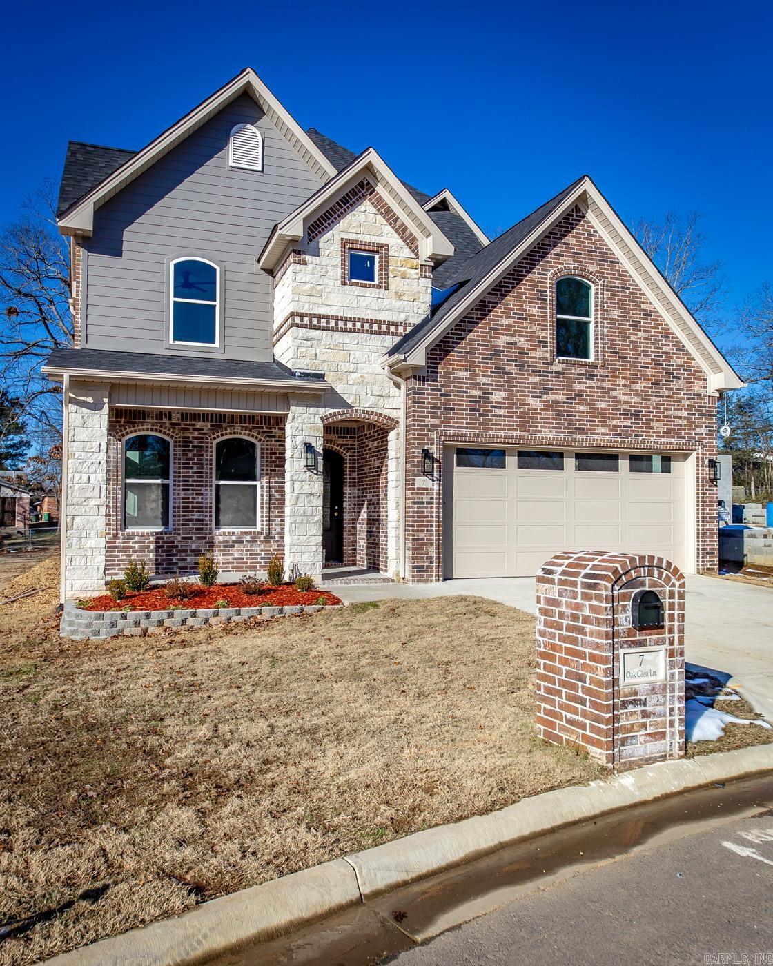 Exquisite Traditional Home with Luxury Features! This home offers 6 spacious bedrooms, 4 full bathrooms, and a bonus room, this property is designed to meet the needs of any modern family while exuding elegance at every turn. The extra-large kitchen is a chef's dream, featuring luxury appliances, inset cabinetry, and a spacious eat-in bar area that overlooks a floor-to-ceiling tiled fireplace. The stunning fireplace is complemented by extravagant lighting features, creating a perfect focal point in the heart of the home. The home also boasts steel entry door, exposed wood beams, and unique wall accents that give the home a touch of character and warmth. The incredible lighting fixtures throughout the home highlight the attention to detail and craftsmanship. In the master suite, indulge in a spa-like retreat with a luxury bath that includes smart toilets, lighted and fogless mirrors, wall-to-wall tile, upgraded shower faucets, and a soaking tub perfect for relaxation. Connected to the master bath is a spacious closet, which also serves as a safe room for peace of mind. The home also features a two-car garage and an inviting tiled outdoor patio with a wood-burning fireplace.
