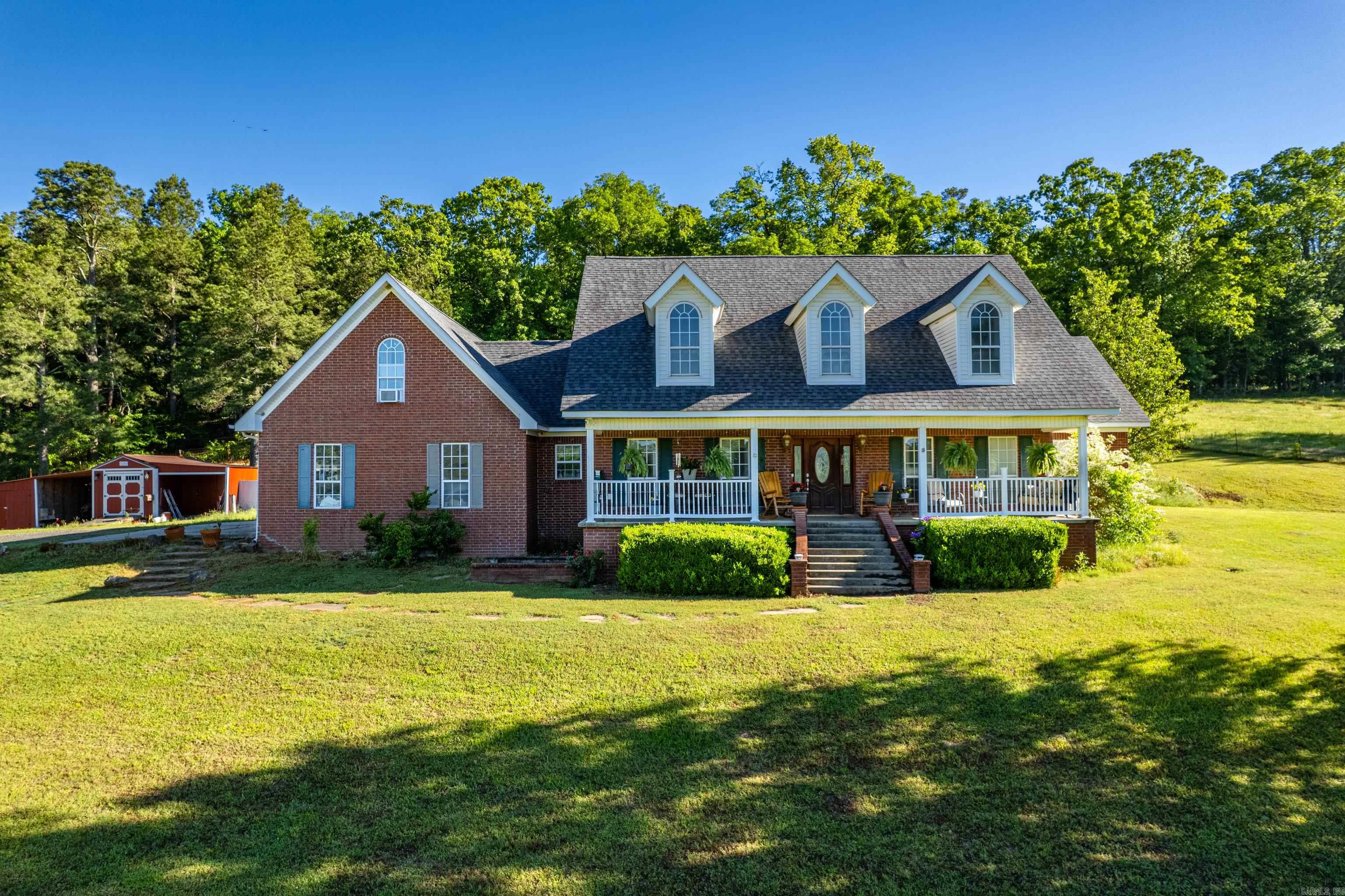 What a deal for this bundle! 4 bed, 3.5 bath, 2,911 sq ft. home with an in-ground swimming pool with cabana/and half-bath, 2 barns with water/electric, stocked, spring-fed pond with year-round water, 400 ft of Caney Creek access, RV hook-ups, 22 acres, plus a like-new 3/2 mobile home with custom built porches and a 20x25 shop with covered overhang for parking. Five minutes from the beautiful Caddo River and across the street from the Glenwood Country Club golf course.
