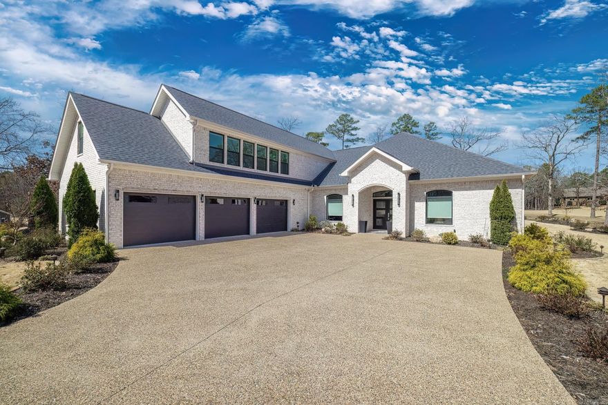 This open and spacious custom built home has so many extras!  The main level of the home boasts 3 oversized bedrooms in a split floor plan.  The master bedroom includes remote controlled roller shades and a huge master bath with an oversized walk-in shower and walk-in closet. On the other side of the home, the two very spacious guest rooms share a Jack-and-Jill bathroom.  There is also a separate office on the main level, a fabulous kitchen with pullouts and soft close cabinetry, a double oven and a gas cooktop.  Upon exiting the french doors facing hole #12, you will have officially entered paradise!  The outdoor kitchen and oversized custom tile patio are fully covered and overlook the saltwater pool and saltwater hot tub, both fully enclosed with a wrought iron fence.  The lavish landscaping consists of a combination of rock, stone pavers, lush shrubs and trees, Zoysia grass, and a Rainbird sprinkler system.  There is storage galore throughout the home, especially the oversized laundry room and 3-car garage.  The laundry also has a wine fridge, ice maker and sink.  Some furnishings are negotiable!  Schedule your showing today because this oasis is going to go quick!