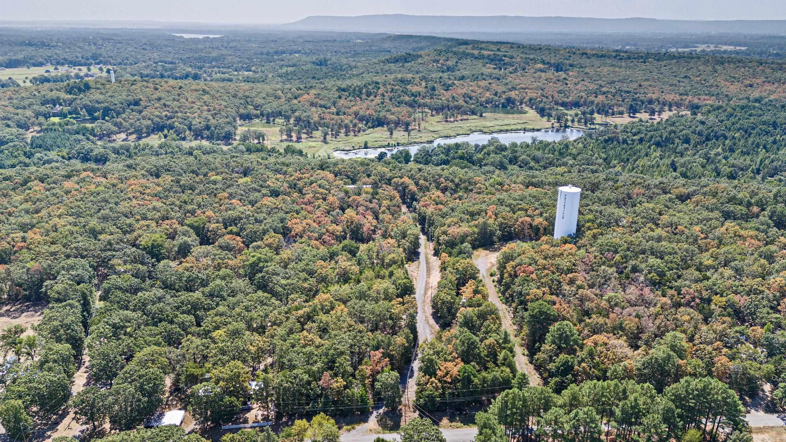 Discover 5.93 acres of gated, rectangular-shaped land with a gentle slope upward, offering privacy and scenic views. The property includes a manufactured home ready for remodeling, perfect for creating a custom residence or income property. A second building site is in place with power, water, and a septic system, making expansion or new construction easier. A storage building provides space for tools, equipment, or recreational gear. The upward slope enhances the possibilities for building with a view, landscaping, or creating tiered outdoor spaces. Whether youāre seeking a renovation project, investment opportunity, or a private retreat with room to grow, this acreage delivers valuable infrastructure and great potential. Located in a peaceful setting yet convenient to local amenities, itās an ideal canvas for your vision.