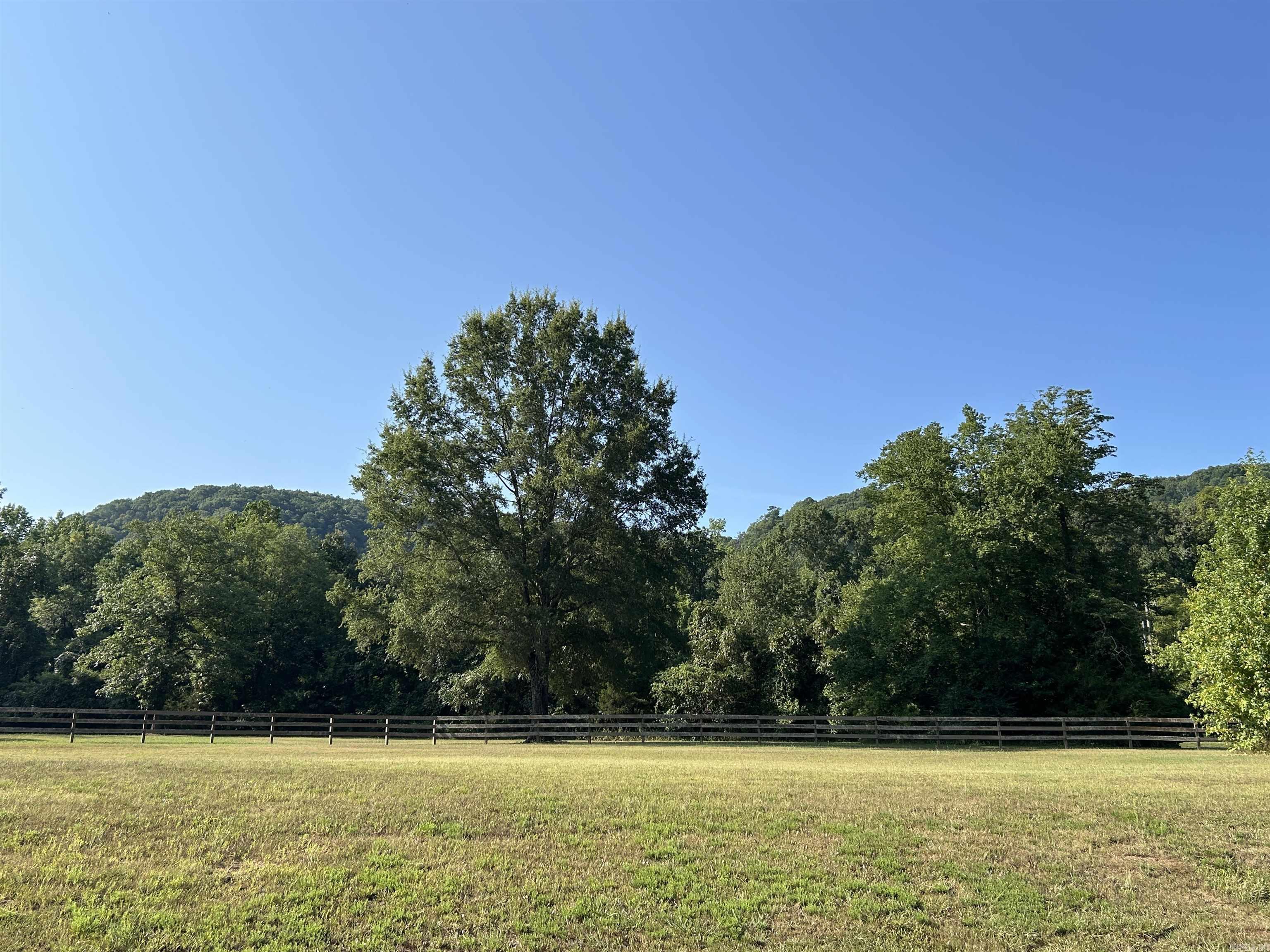**Premier Lot in Rivers Edge Subdivision** Discover the finest vacant lot in Cleburne County, a rare gem in the prestigious Rivers Edge Subdivision. Close proximity to the Little Red River, this exquisite lot offers unrivaled luxury and natural beauty, perfect for your dream home. Backing up to a lush green area, it ensures privacy and stunning views of Libby Bluff with the soothing sounds of the river just steps away. The subdivision is adjacent to a public launch ramp at Lobo, enjoy world-class fishing and boating on the pristine Little Red River. Rivers Edge redefines upscale living with gated entry for security and exclusivity. Savor premium amenities: a community boat dock for waterfront adventures, a sparkling pool for relaxation, a charming pond, & a clubhouse for gatherings. Utilities—water, high-speed internet, and electric—are conveniently at the road, ready for your custom build. This lot is more than land; it’s a lifestyle of elegance and adventure. With its prime location, unmatched amenities, and serene riverside setting, it stands alone as Cleburne County’s most coveted property. Seize this opportunity to create your legacy in a paradise of luxury & tranquility.