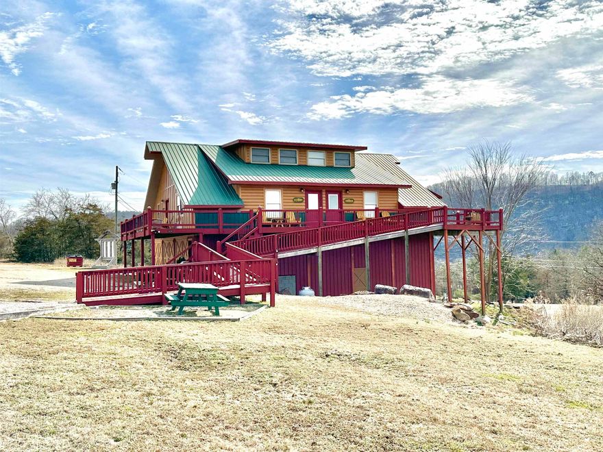FULLY FURNISHED FISH TALES LODGE is available to purchase!! This property offers an amazing view of the mountains and is located minutes from the famous White River, Sylamore Creeks, & Downtown Mountain View! It is currently being used as a nightly Vacation Rental but has endless possibilities. It features 4 identical units all on one floor with handicap accessibility and a private entrance to each! Each unit has an open kitchen/ living area, bedroom, 1 bathroom, plus an open loft serving as an additional bedroom as well as access to a shared laundry room. Below the units you will find tons of storage! 3 separate storage rooms as well as boat or RV storage! *All items will convey minus personal items, supplies, & items inside storage rooms*