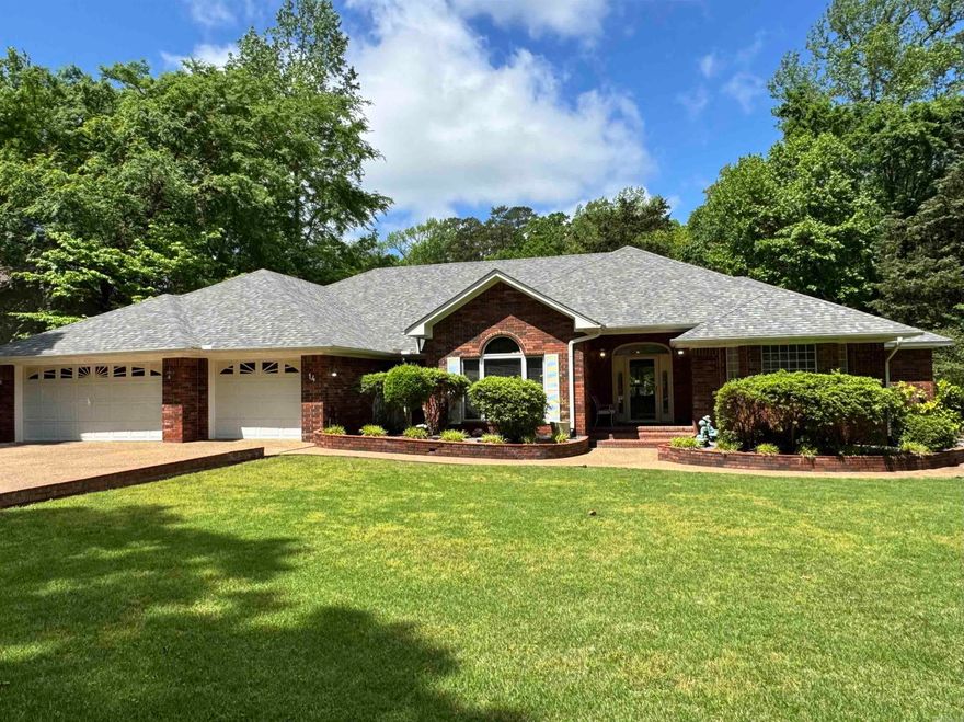 Looking for a one level home on level Golf front lot with an Arkansas room, separate office, and 3 car garage? Yes, Please!  This Elegant Golf Front Home on Cortez features a Timeless Style with Comfortable living in mind! Enjoy the generous floor plan with sweeping views of the 13th tee box at Cortez Golf Course from this beautifully maintained, classically styled home. Located in one of Hot Springs Village’s most beautiful neighborhoods, this residence offers a perfect blend of sophistication and comfort, ideal for those who appreciate refined living with a view. Fall colors on Cortez are a favorite!  Step in to be greeted by crown molding throughout, tray ceilings, and architectural columns that frame the spacious formal dining room and formal living area! The spacious layout features large bedrooms, including a primary suite with its own private office, an over-sized walk-in closet, and sitting area!  Walls of windows bring in natural light and golf course views. Built-ins add character and functionality, while the manicured yard and impressive curb appeal reflect pride of ownership throughout.  Back patio feels like a retreat of it's own! New Roof 2024! Call today for a tour!