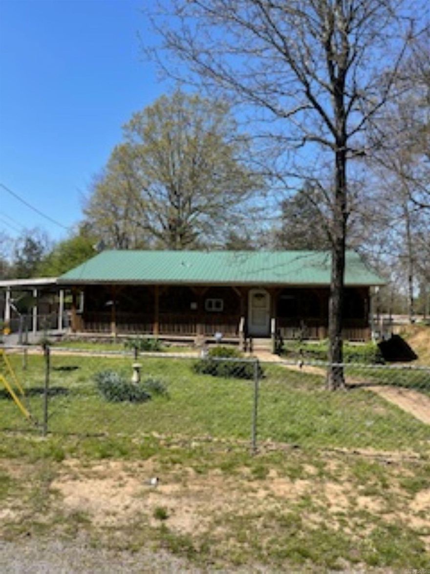 This 2-bed, 1.5-bath home near Sugar Loaf Marina on Greers Ferry Lake has a storage shop, rear parking with an entrance, and a fenced front. The home needs some TLC but could be a great residence or weekend lake house. Sold as-is. See agent remarks.