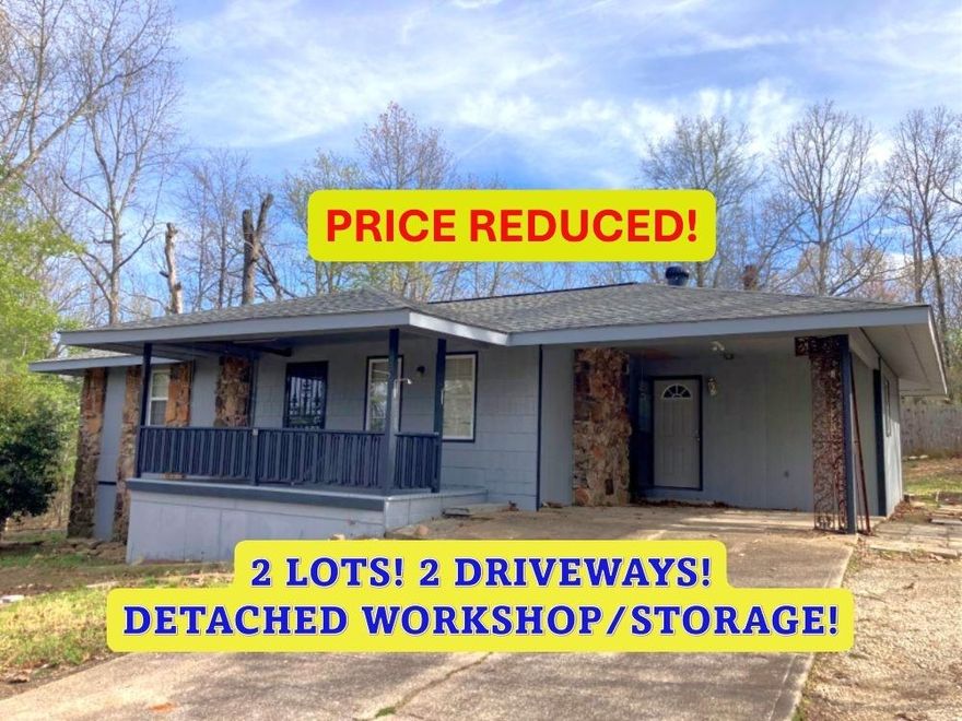 PRICED REDUCED!  HOME on 2 LOTS w/approx 18'x24' detached WORKSHOP/STORAGE and 2nd driveway! 2 Bedroom, 1.5 Bath home. This home has a big open floor plan with vaulted ceilings, new ceiling fan w/lights & native stone fireplace with gas hookup. Large Mudroom off the carport is perfect for extra space for a freezer and shelves for a pantry. Newer countertops and Gas Cookstove freshen up the kitchen. Nice large, tiled shower with seat in the hall bathroom and 2 good size bedrooms. All of the windows have been replaced with vinyl double pain windows. New 200-amp breaker box was installed 2 years ago to bring the electrical in the house up to today's needs. Approx 17'x8' Covered front porch and big back deck (approx. 15'3"x12'3") for family BBQs. The deck even has a propane hookup for your gas grill or you could use it for your patio heater! The second lot has had an additional driveway that goes to the side street for easy access to the detached shop/storage building and to better access the main road. Listing #2426.