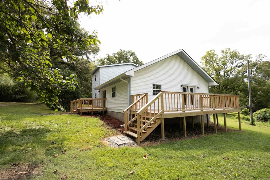 Take a look! New well, new septic, new hvac, fresh paint, new flooring, new roof, new decks, totally updated kitchen and bathrooms! This home feels like its a brand-new home! Close to town but out in the country with no restrictions. You are sure to be impressed!