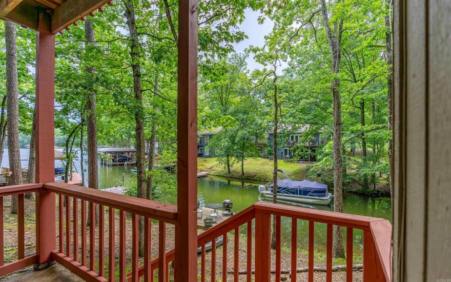 3 Bedroom WATERFRONT townhome on Lake DeSoto! Enjoy Sunsets from your Back Deck or the Lower Patio! BRAND NEW ROOF! These units make great Nightly Rentals! Primary Bed with Deck access and Bath are on the main floor, with 2 more Bedrooms and Full Bath on the Lower Level. There is also an oversized Laundry/Storage/Owner's Room (in addition to the 3 Bedrooms). Townhome dues include garbage pickup. Lake DeSoto is one of 4 Full Recreational Lakes in Hot Springs Village (water ski lake)! This 200 acre lake offers a Beach, the Waypoint Marina, Boat Launch and Walking Trails! Hot Springs Village boasts 11 Lakes & 9 Golf Courses, Tennis, Pickleball, Mini Golf, Bocce Ball, Lawn Bowling, Dog Park, Fitness Center, Indoor & Outdoor Pools, Performing Arts Center, Archery Range, 20+ Miles of Walking Trails, and much more! DON'T MISS THE ATTACHED VIRTUAL TOUR!