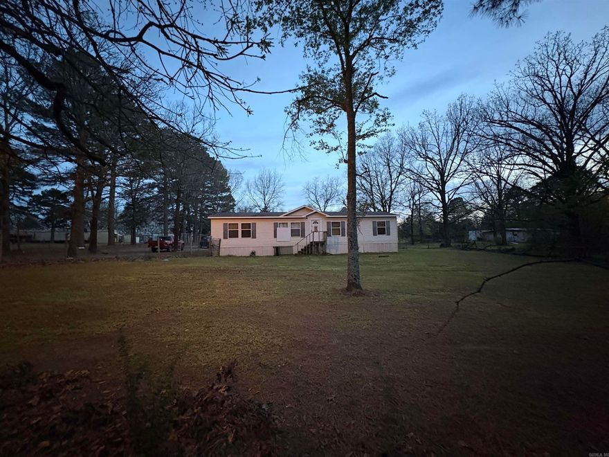 This manufactured home is a 28x56 Clayton built in 2009 on approx. one (1) acre being sold AS-IS.  The home sits on concrete footings has two living areas, three bedrooms, and two bathrooms.  Agents see agent remarks.