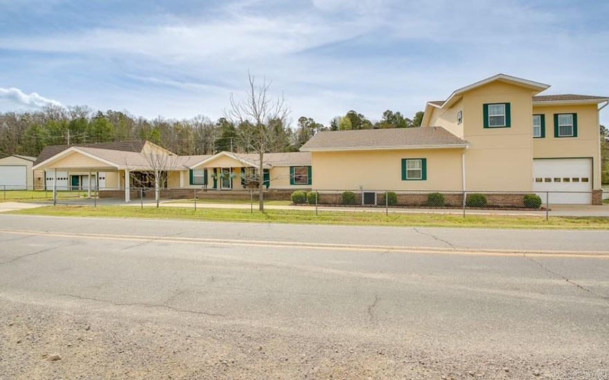 This expansive 4-bedroom, 5.5-bath home on Lake Hamilton is perfect for entertaining, relaxing, and making lifelong memories. With room to comfortably sleep 13. This thoughtfully designed home features two full kitchens, two primary suites, a large game room, and even a safe room for added peace of mind. Whether you're hosting weekend guests or enjoying a relaxing evening, the home’s spacious interior and smart layout offer the perfect blend of comfort and functionality. Step outside and soak in the beauty of 340± feet of lake and road frontage, offering stunning views and access to the water. Across the street, you'll find a commercial boat launch ramp and dedicated truck and trailer parking, making water adventures a breeze. The property also includes three versatile shops/storage buildings—ideal for hobbies, extra storage, or future projects. Come experience the perfect blend of luxury and lakeside living. Property can be purchased with more land and structures. See MLS # 25010667 Agents see remarks