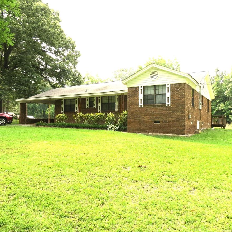 This well maintained home sits on 2 acres outside of the city limits.  2 bedrooms and 2 baths, with 1518sf. Large dining area, Fireplace, SS appliances, refrigerator conveys with the property, lots of cabinets.  Large Laundry room.   Back deck, Storm shelter, garden area, storage building, fruit tree.  Call today to see about NO Down Payment Loan!!