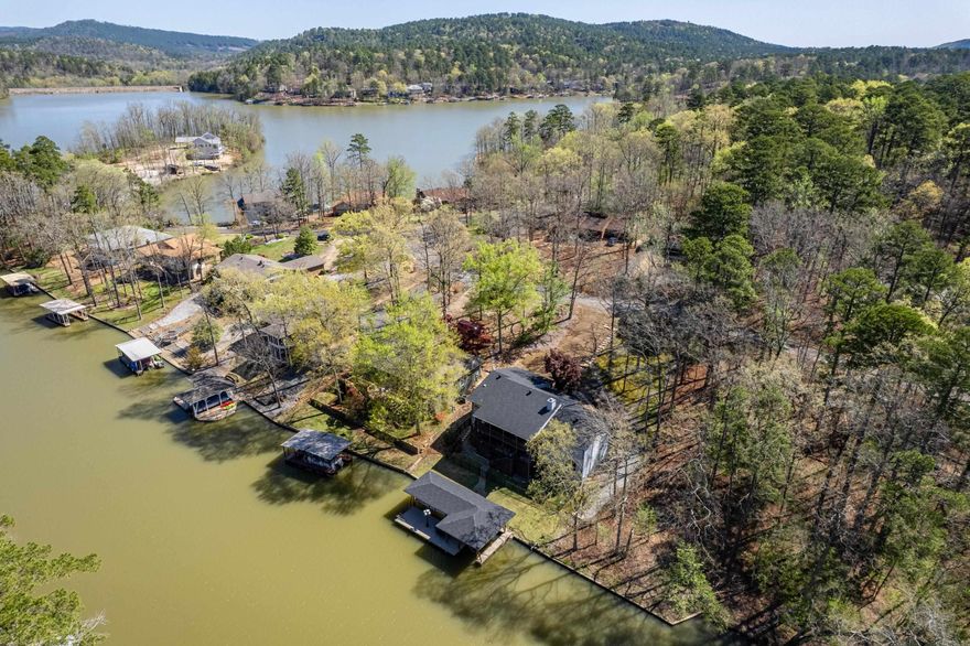 Discover the perfect blend of luxury and comfort in this updated, fully furnished 3 bed. 2 1/2 bath Lake Cortez lakefront home. With two spacious family rooms, large covered deck and large covered patio, this property is ideal for both relaxation and entertaining. Enjoy your very own double slip boat dock with lifts and a 24 ft. pontoon that is perfect for adventurers and water enthusiasts alike, or slip into your kayaks and have a relaxing day! Beautiful wrought iron fencing enhances the outdoor charm. Unwind in the hot tub and enjoy all the amenities this beautiful home has to offer. Coffee nook upstairs and sink downstairs will satisfy any coffee enthusiast. New roof, new HVAC, new sump pump, sprinkler system. Fully encapsulated crawl space is such a huge plus! This home has it all, a lifestyle of leisure, fun and family gatherings. Don't miss your chance to own this slice of paradise-schedule a viewing today!