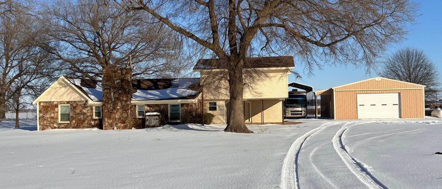 This home has had a new roof and new central h/a unit installed within the past 2 years. Wood burning fireplace, updated kitchen. appliances included. 32 x 40 shop building with RV cover (RV negotible). lower level features 3 bedroom, one bathroom, Family room, Kitchen,Dining and laundry. Primary Bedroom with full Bathroom upstairs. e-z lift for stairs.