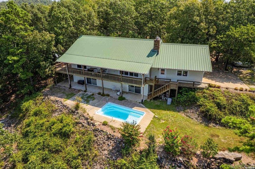 Welcome to your destination away from the hustle and bustle of city life.  Just a few minutes out of town, but in the middle of an expansive hard wood paradise surrounded by wildlife, unparallelled views and the peace of nature.  With the luxury of an in-ground pool, 2 kitchens, open floor plan, rich hard wood built in cabinetry, a two-car garage, along with separate shop and extra garage, this two-story getaway occupies only one of many property peaks overlooking the expansive view of mountains and Lake DeGray. With 149 acres, seeing is believing once you break through the trees to the home site and witness the breathtaking views.  Come home to serenity, located between Hot Springs and Bismarck surrounded by the Ross Foundation and one of the remaining untouched hardwood forests.