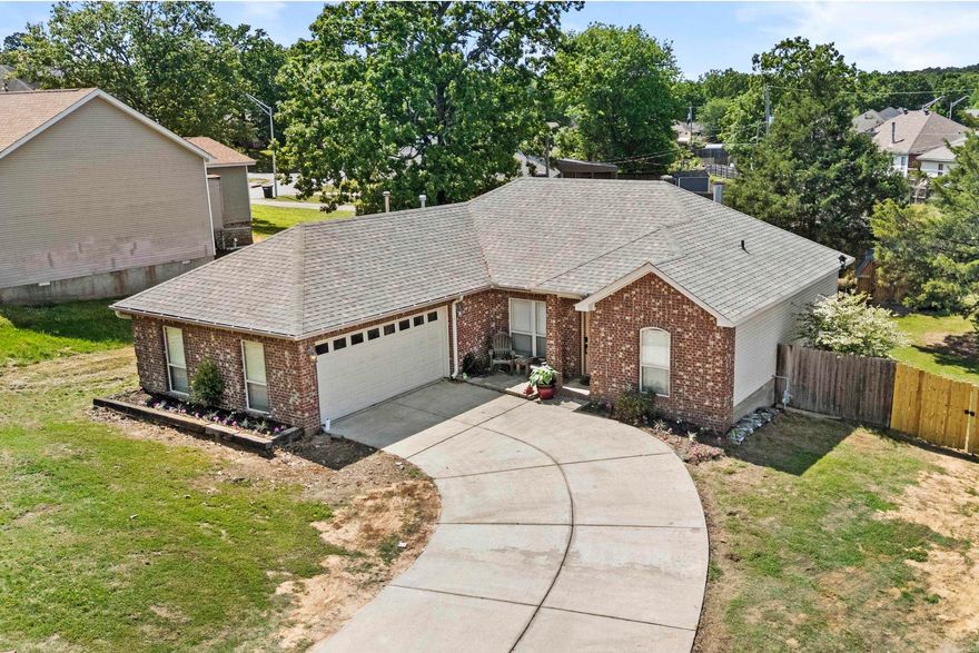 Discover this adorable and welcoming home nestled on a tranquil cul-de-sac, featuring a spacious open floor plan perfect for comfortable living and entertaining. The stylish kitchen boasts painted cabinets, a tile floor, a convenient breakfast bar, stainless steel appliances, a tile backsplash, and a generous pantry—ideal for culinary enthusiasts. The expansive living area is anchored by a cozy wood-burning fireplace with a gas starter and is enhanced by a stunning tray ceiling, creating an inviting atmosphere. The thoughtfully designed split-bedroom layout offers a large, luxurious master suite with double sinks, a relaxing jetted tub, a spacious shower, and his-and-hers closets. Both guest rooms are generously sized, with one featuring a vaulted ceiling for added charm. Step outside to the level lot with a lovely deck, perfect for outdoor gatherings and relaxation. This home truly has it all—must see to appreciate all the wonderful features!